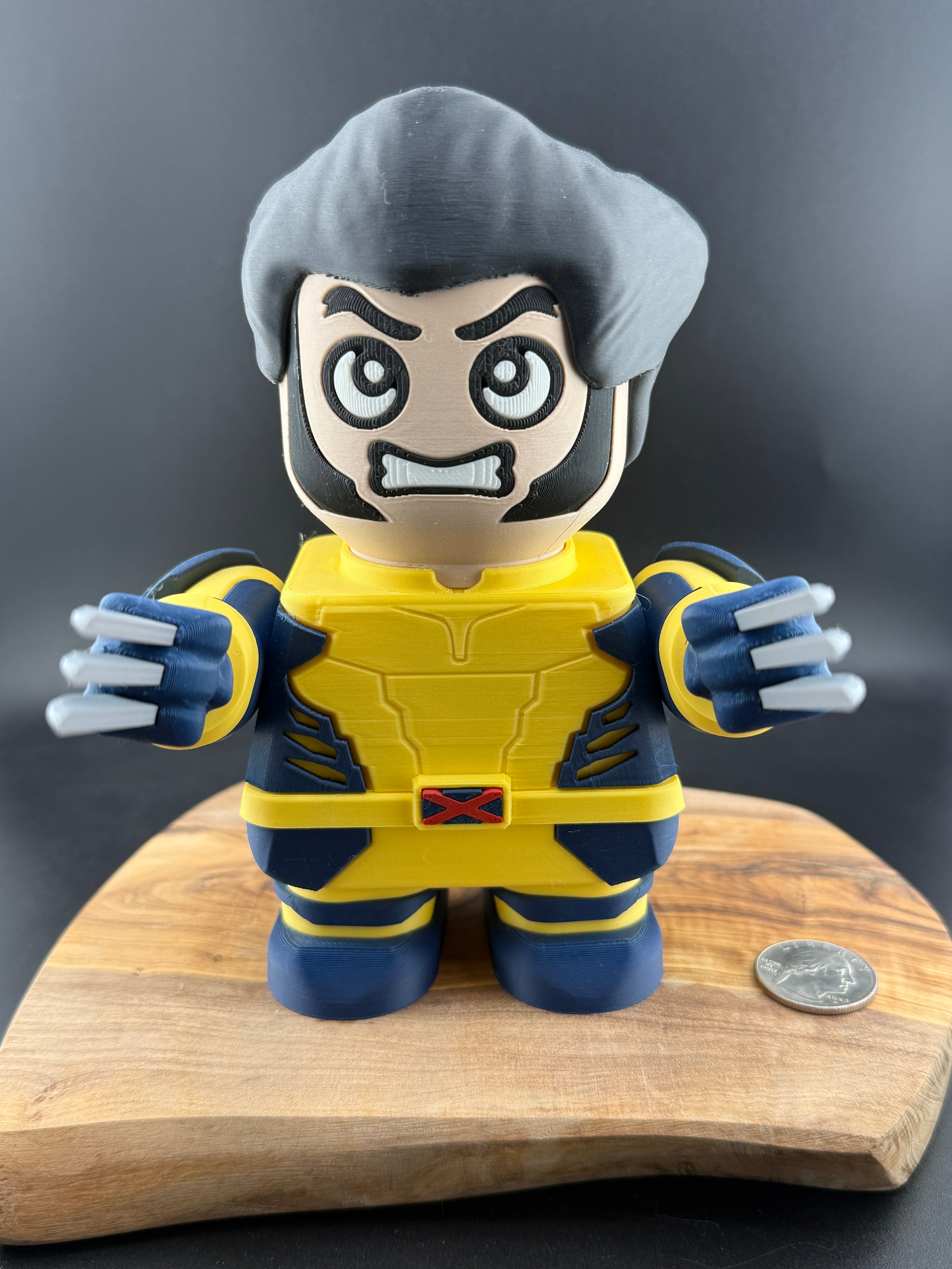 Toy figure of a character in a yellow and blue costume on a wooden stand with a dark background