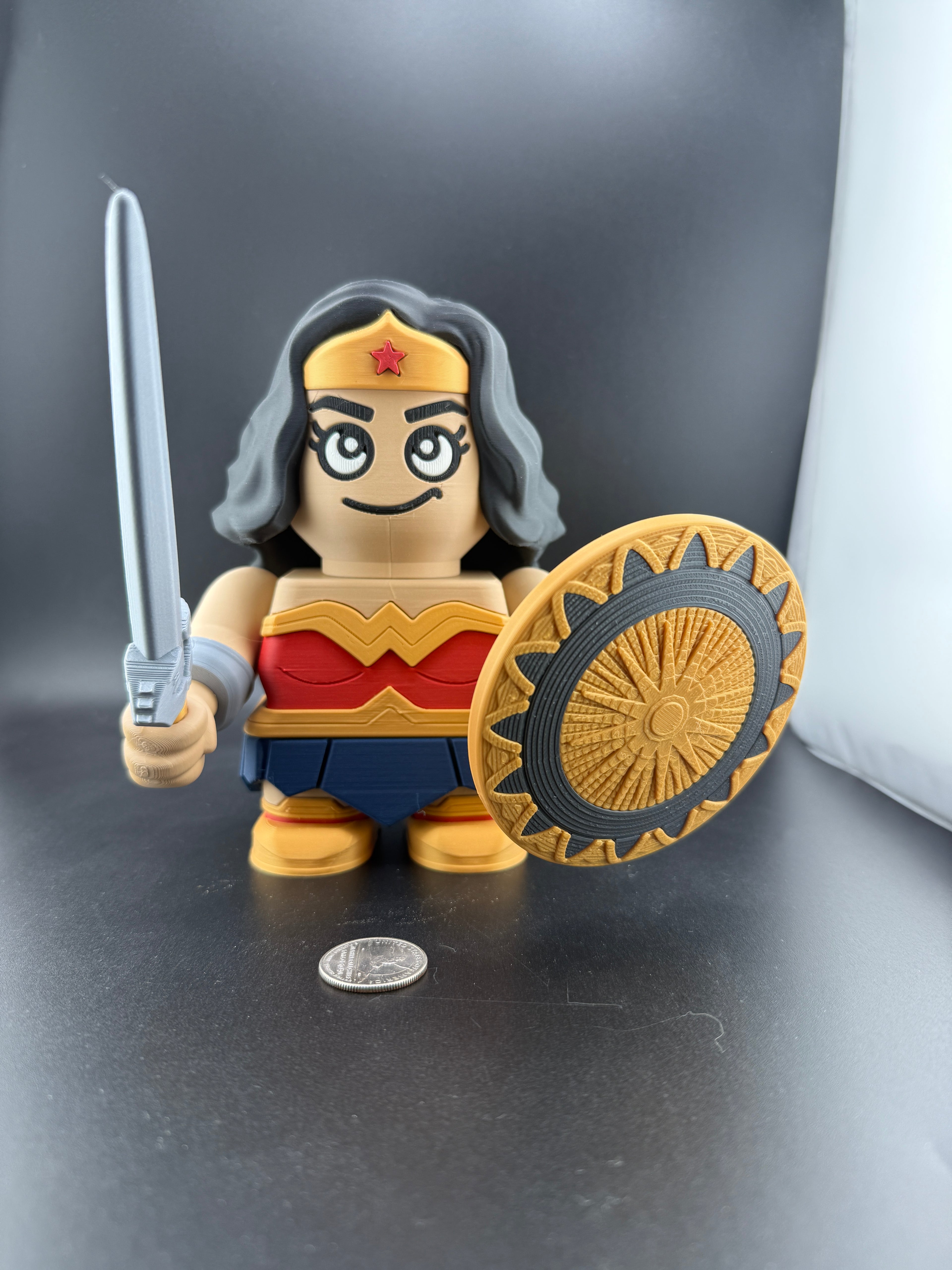 Toy figure of a character with a shield and sword on a dark surface