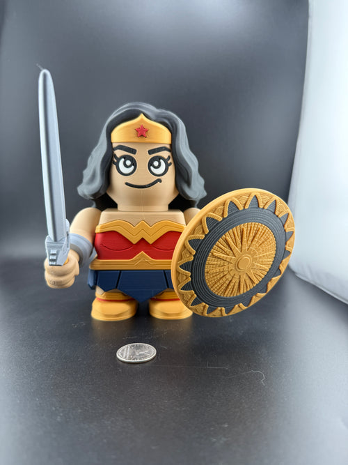 Toy figure of a character with a shield and sword on a dark surface