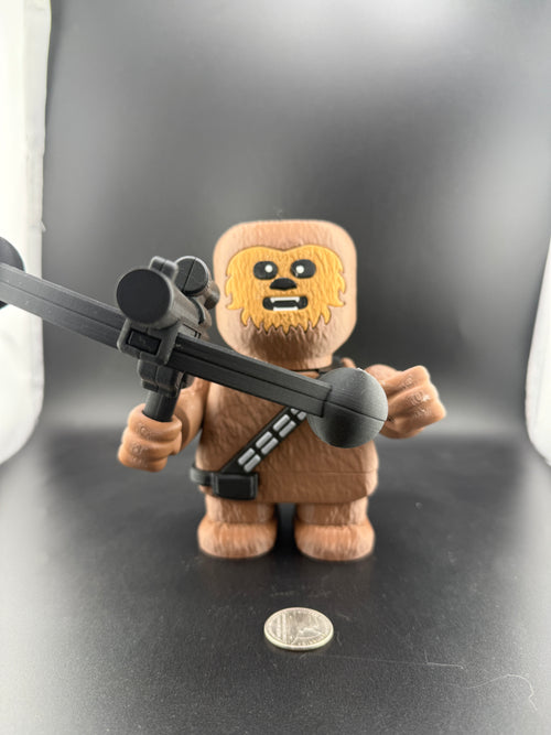 Toy figure of a character with a gun on a dark background