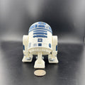 3D Printed droid toy figure on a black background