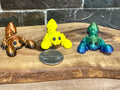 Fidget toy animal on a wooden platform. 